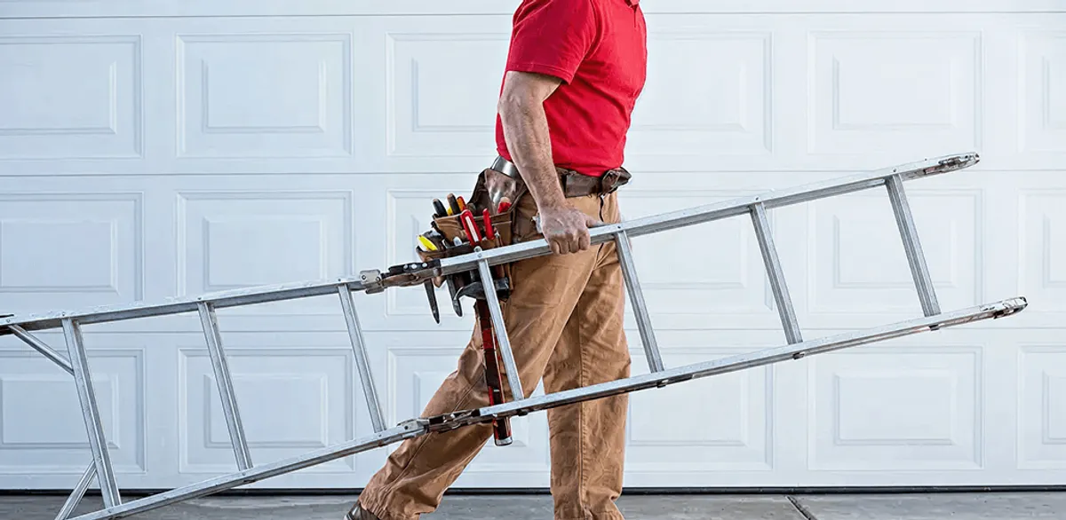Garage door repair technician arriving with tools and ladder in Albuquerque, NM